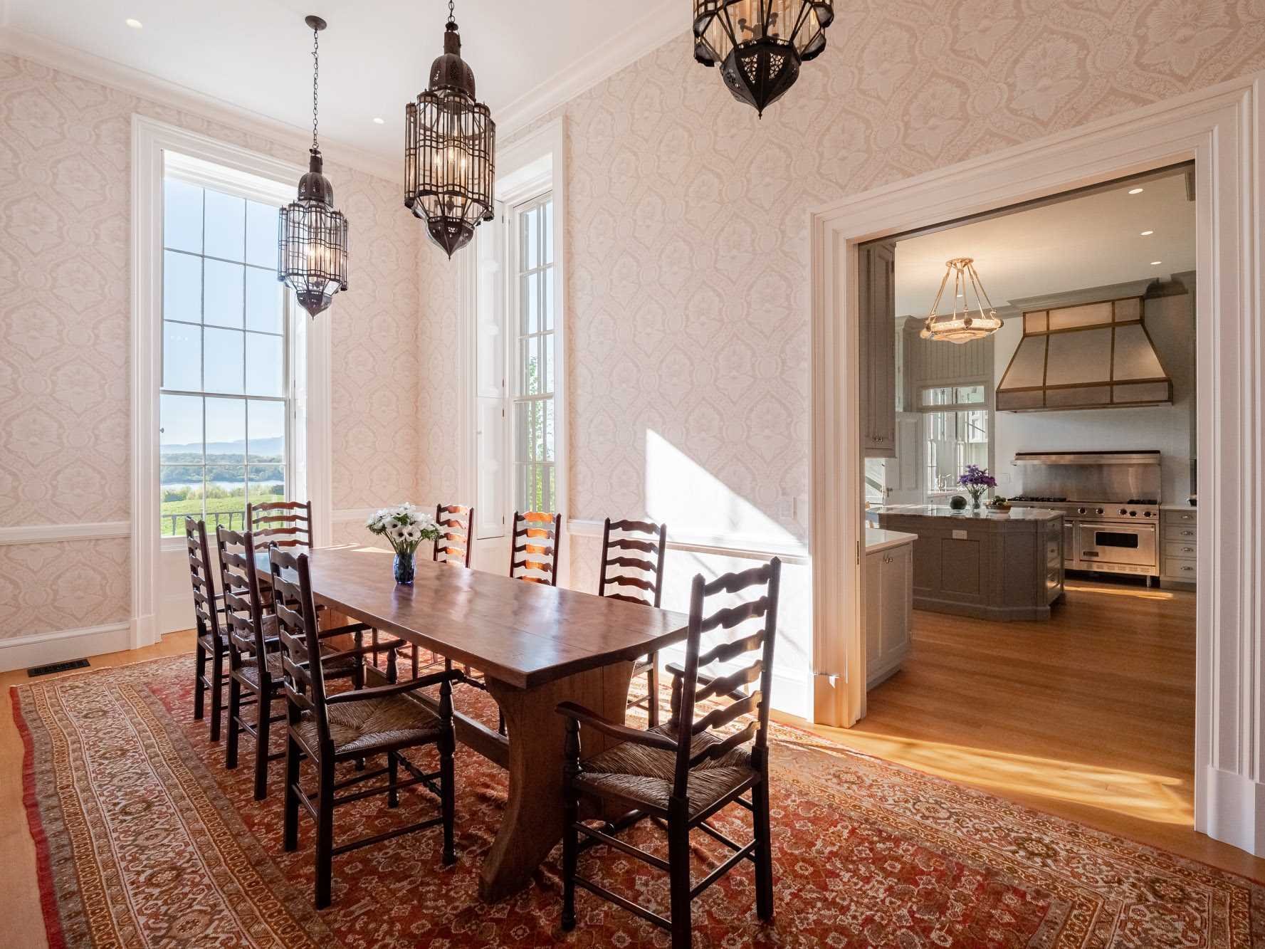 124 Eden Knoll Red Hook, NY 12571 - Photo 16 of 40 a view of a dining room and livingroom with furniture wooden floor a chandelier