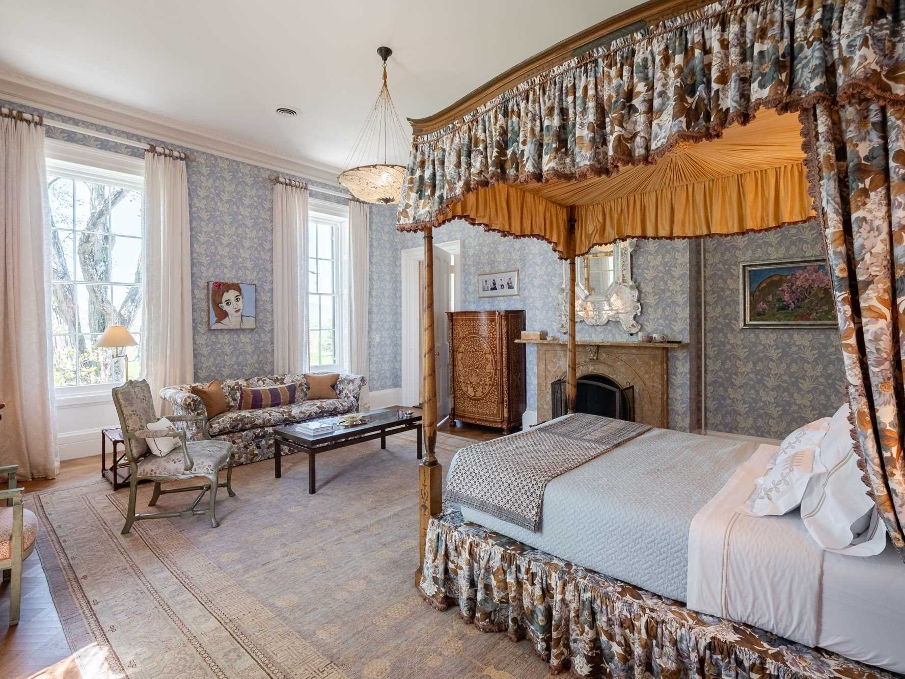 124 Eden Knoll Red Hook, NY 12571 - Photo 26 of 40 a bedroom with a bed and a chandelier