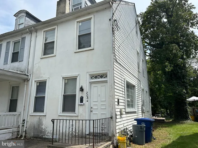 a view of a house with a yard and balcony