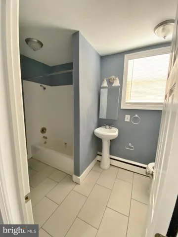 a bathroom with a shower and a toilet