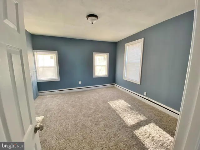 a view of an empty room and window