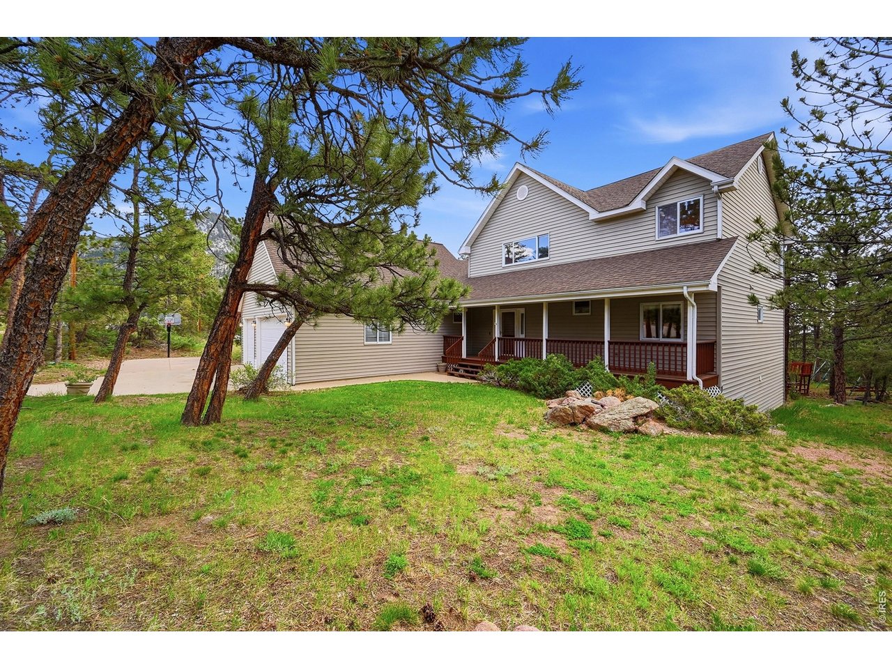 256 Choctaw Road Lyons, CO 80540 - Photo 4 of 50 a view of a house with a yard