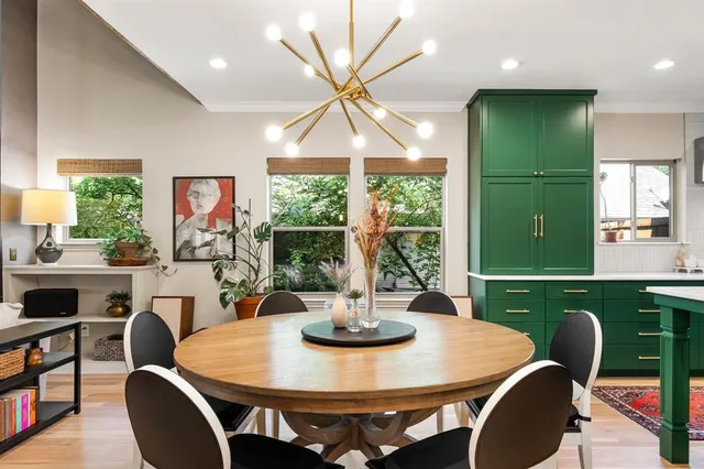 a living room with furniture a rug and a fireplace