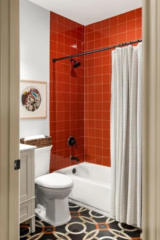 a living room with hard wood cabinets and a window