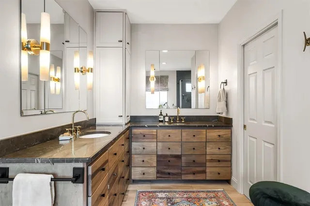 a building outdoor space with patio furniture and potted plants