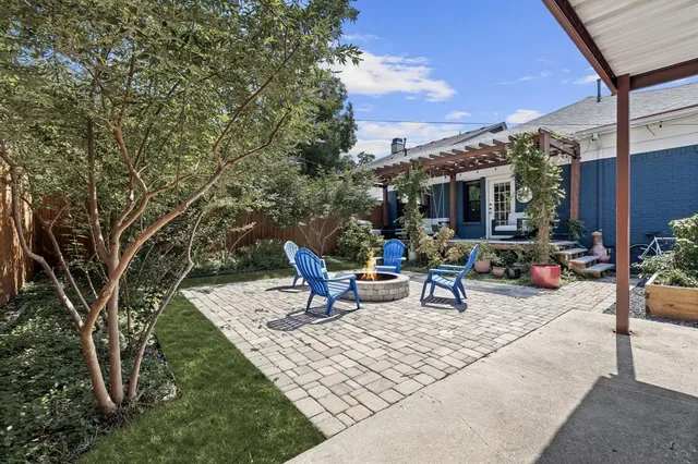 an aerial view of a house with a backyard