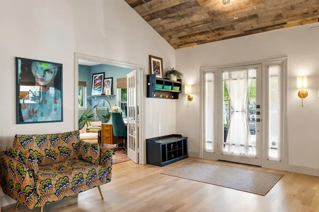 a living room with furniture or couch and a fireplace