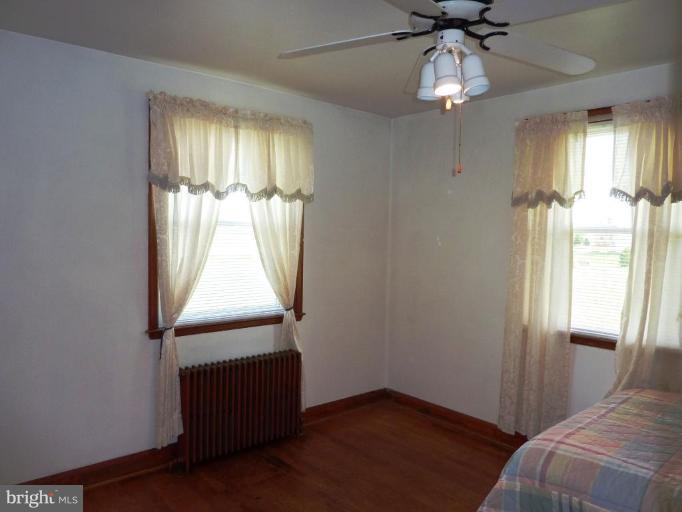 4307 Forge Road Perry Hall, MD 21128 - Photo 22 of 30 wooden floor chandelier and windows in a room