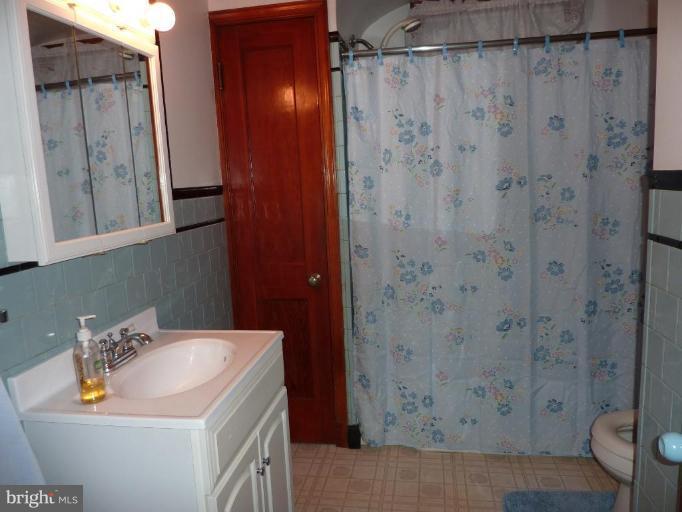 4307 Forge Road Perry Hall, MD 21128 - Photo 24 of 30 a bathroom with a sink a toilet and shower