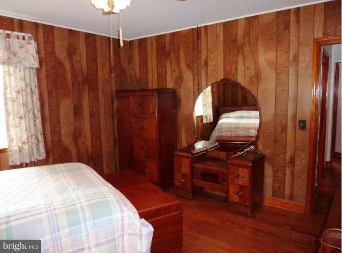 4307 Forge Road Perry Hall, MD 21128 - Photo 25 of 30 a bedroom with a bed and a mirror