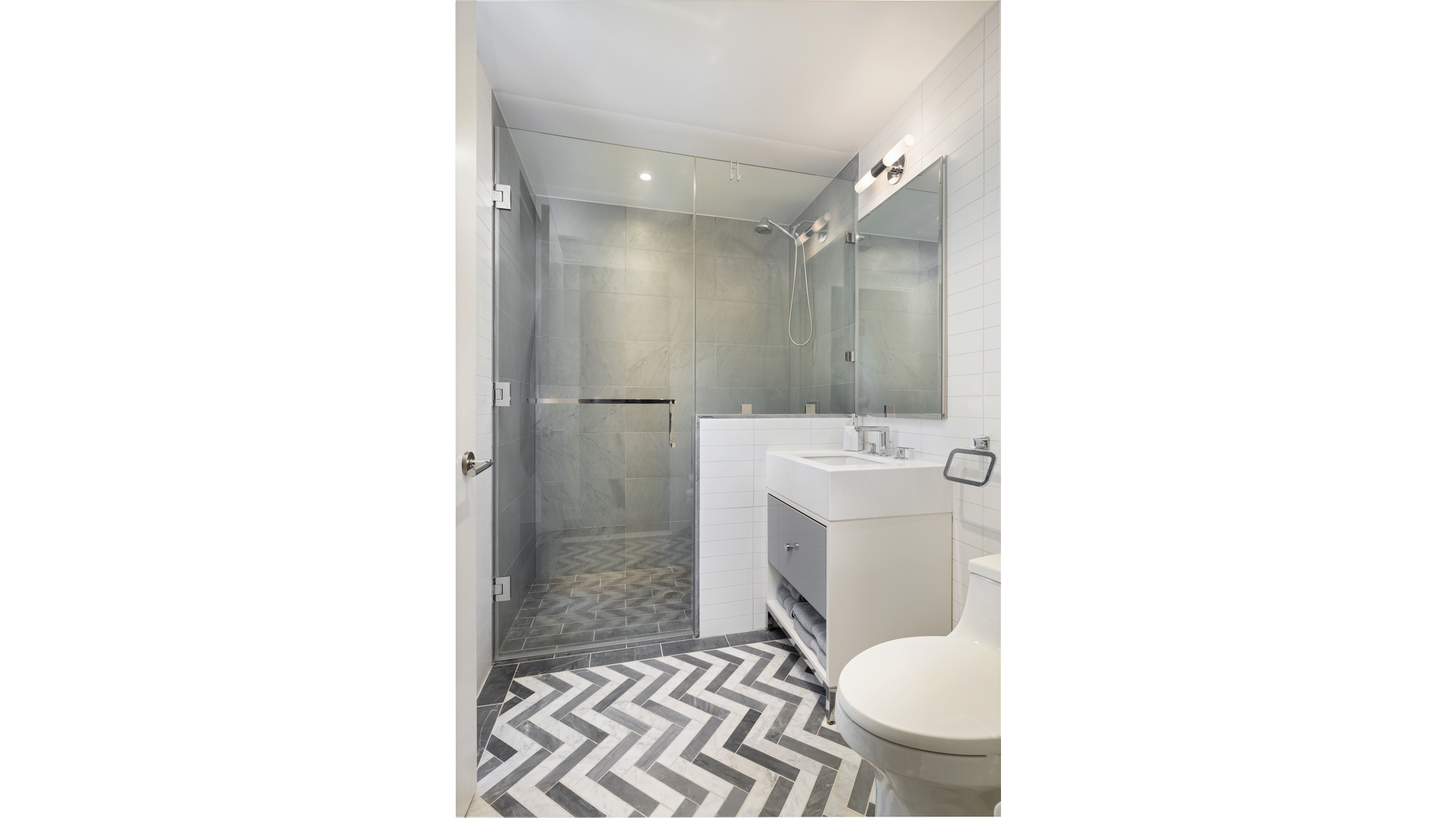 261 West 25th Street, Unit 11A Manhattan, NY 10001 - Photo 12 of 16 a bathroom with a sink and a toilet