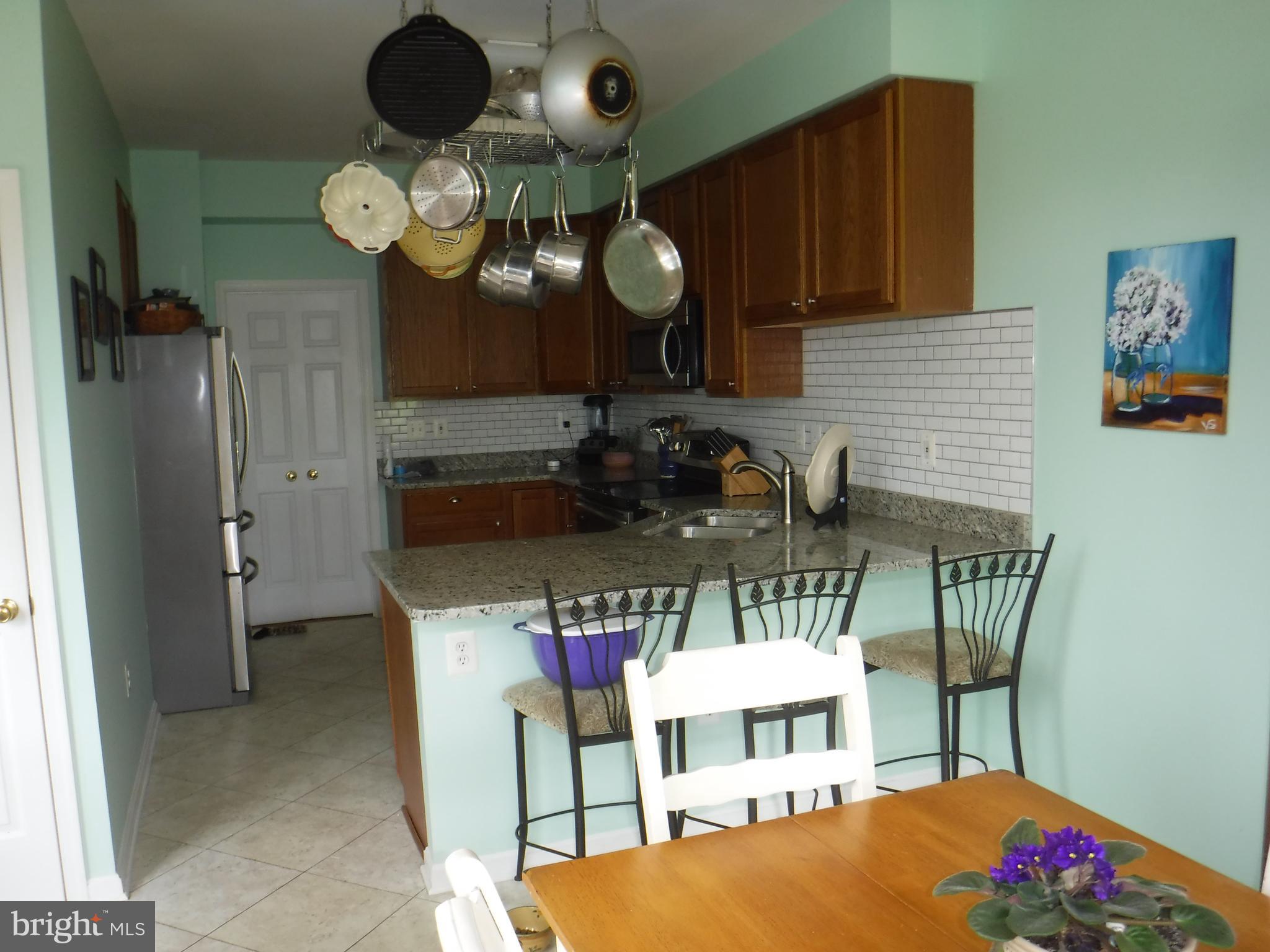 2444 Rippling Brook Road Frederick, MD 21701 - Photo 12 of 49 a view of a dining room with furniture