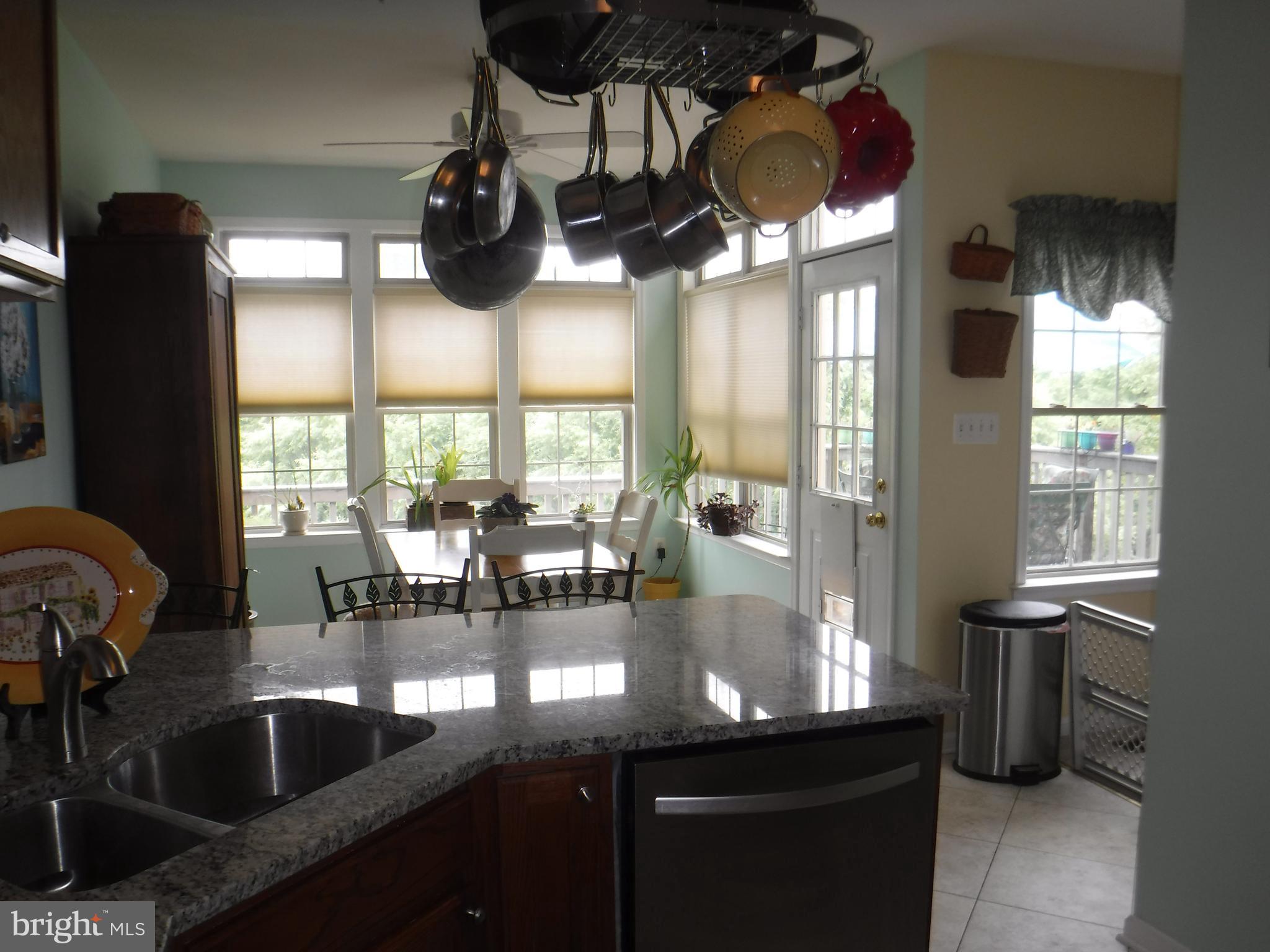 2444 Rippling Brook Road Frederick, MD 21701 - Photo 16 of 49 a kitchen with a sink and chandelier