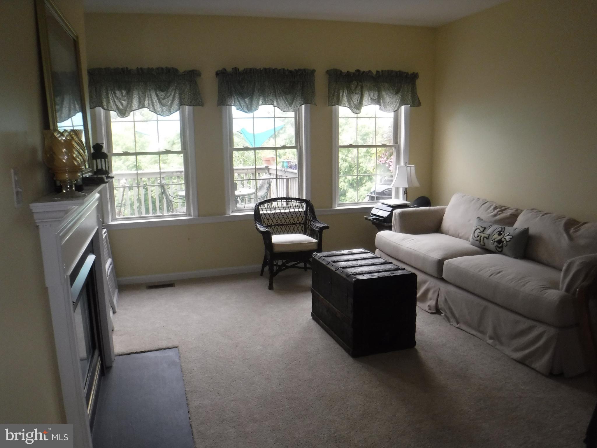 2444 Rippling Brook Road Frederick, MD 21701 - Photo 17 of 49 a living room with furniture and a window