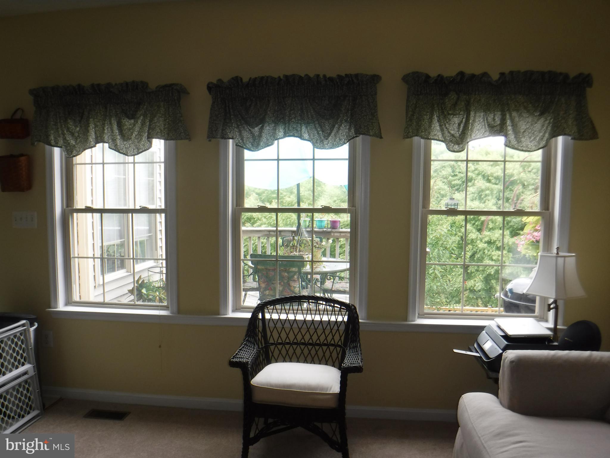 2444 Rippling Brook Road Frederick, MD 21701 - Photo 19 of 49 a living room with furniture and a large window