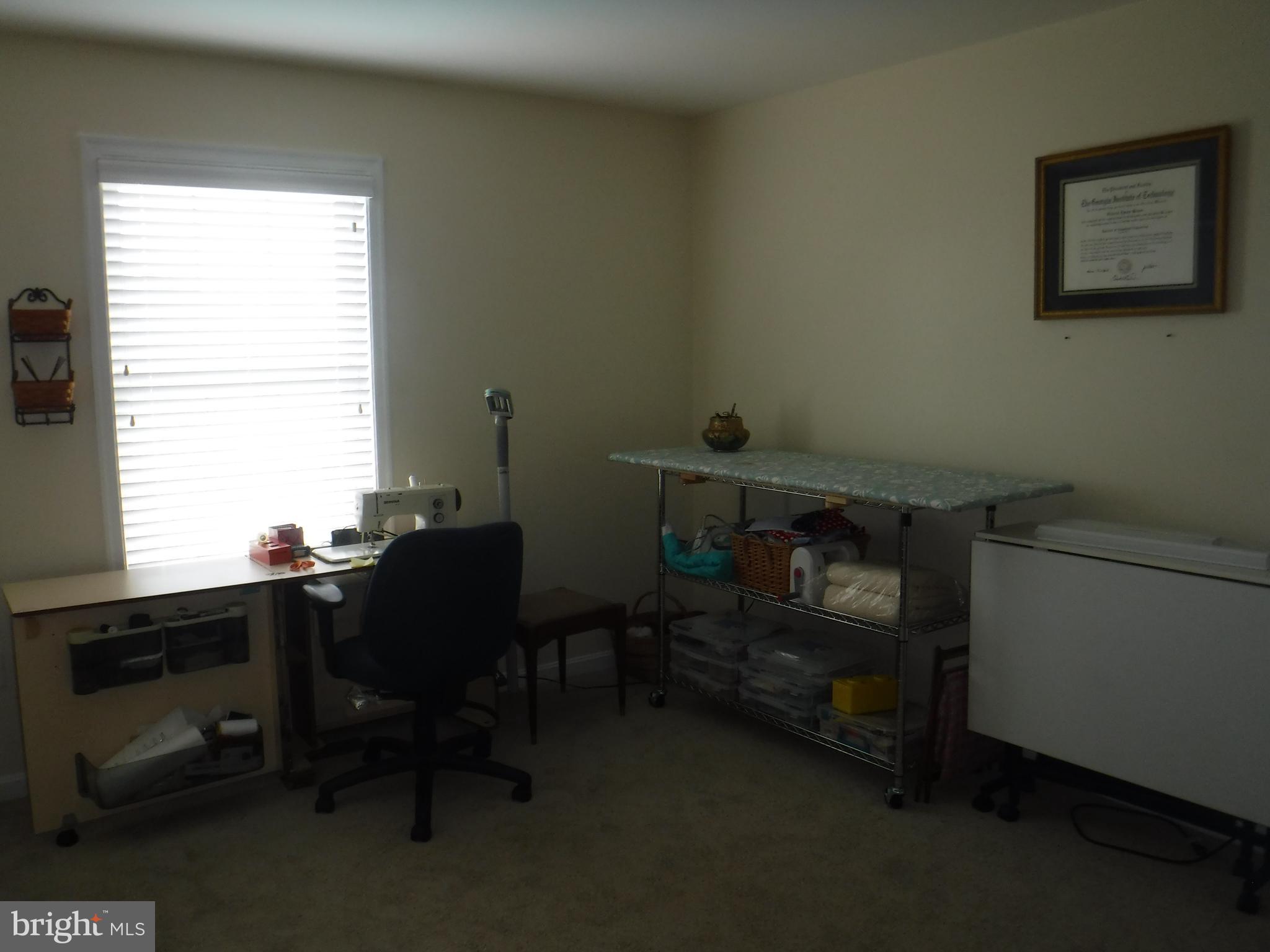 2444 Rippling Brook Road Frederick, MD 21701 - Photo 25 of 49 a room with workspace and a window