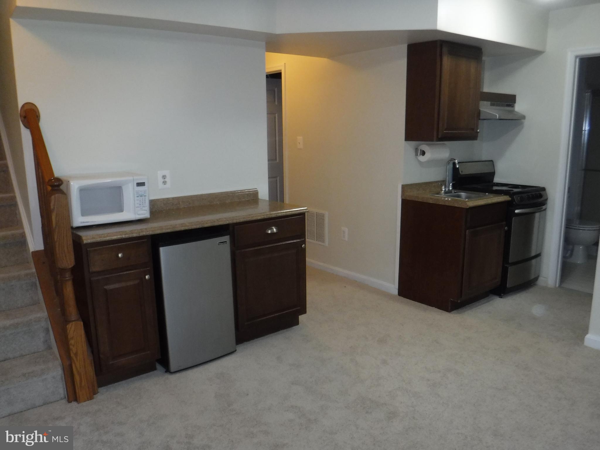 2444 Rippling Brook Road Frederick, MD 21701 - Photo 29 of 49 a kitchen with a sink and a stove