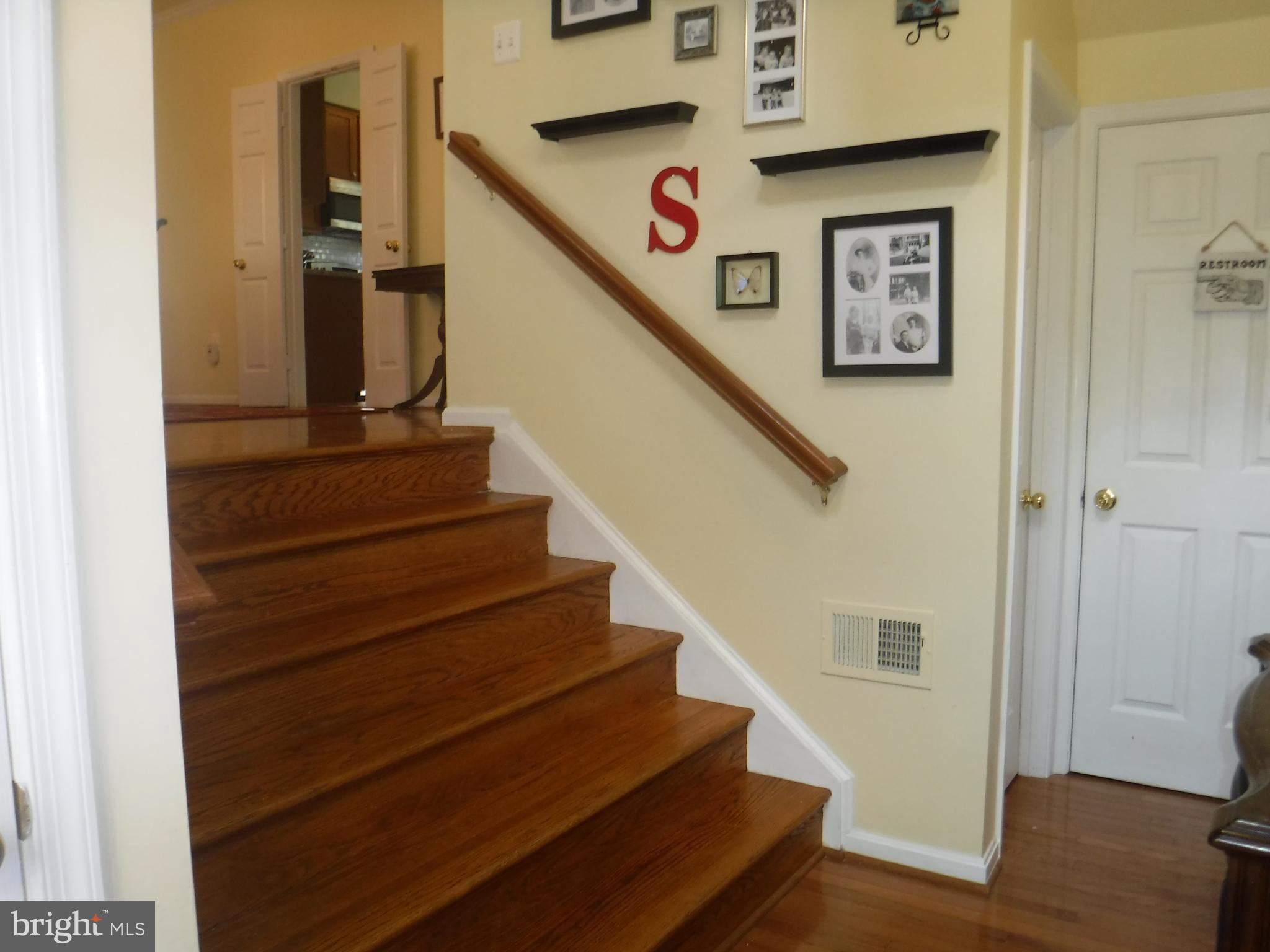 2444 Rippling Brook Road Frederick, MD 21701 - Photo 7 of 49 a view of entryway and hall with wooden floor