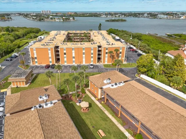 an aerial view of a house with a lake view
