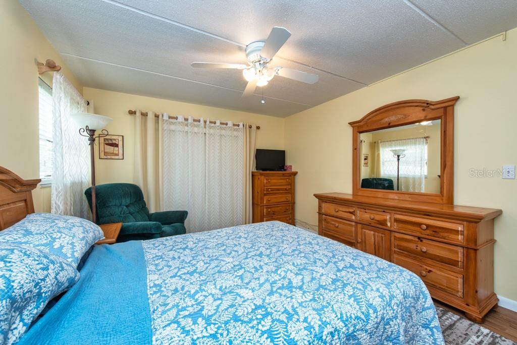 12760 Indian Rocks Road, Unit 601 Largo, FL 33774 - Photo 17 of 47 a bedroom with a bed and a dresser