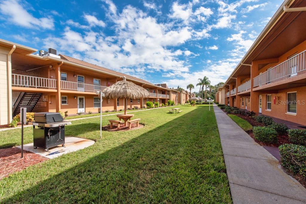12760 Indian Rocks Road, Unit 601 Largo, FL 33774 - Photo 2 of 47 a view of a house with a backyard