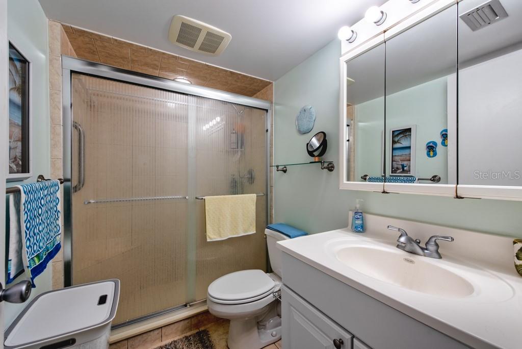 12760 Indian Rocks Road, Unit 601 Largo, FL 33774 - Photo 22 of 47 a bathroom with a sink toilet and shower
