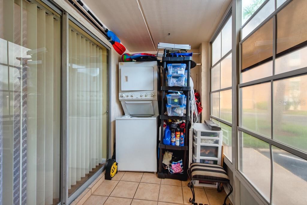 12760 Indian Rocks Road, Unit 601 Largo, FL 33774 - Photo 23 of 47 a utility room with dryer and washer