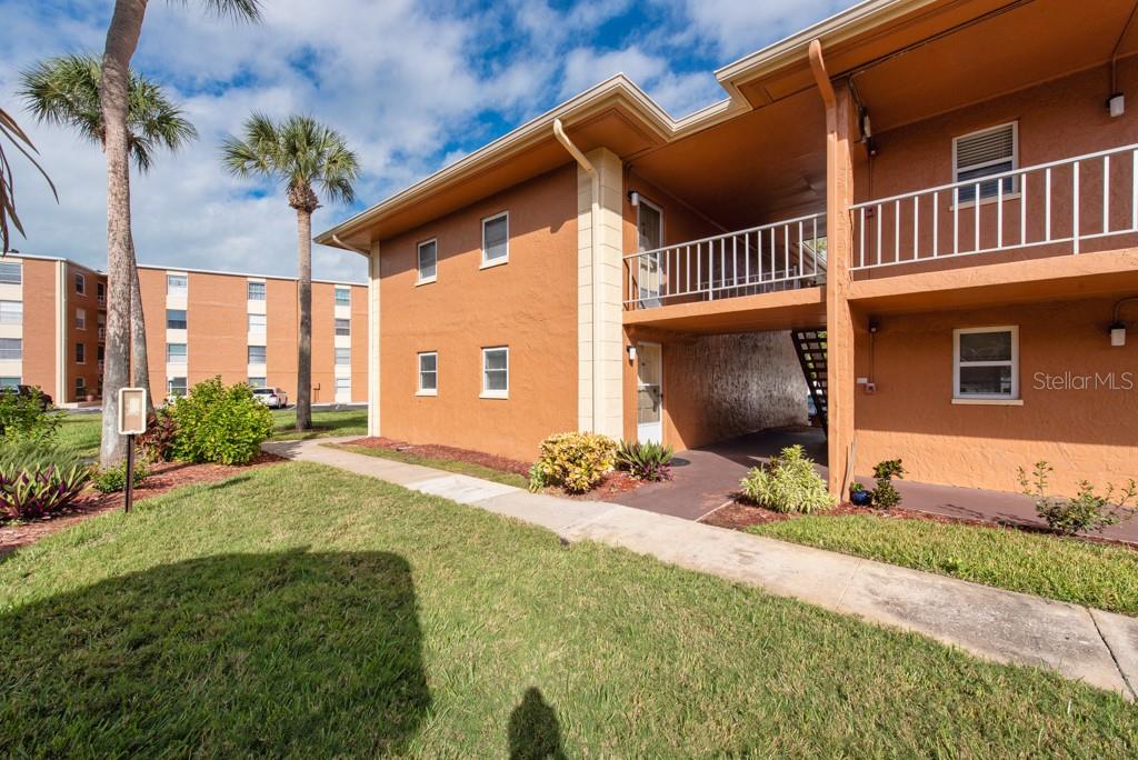 12760 Indian Rocks Road, Unit 601 Largo, FL 33774 - Photo 26 of 47 a front view of a house with garden