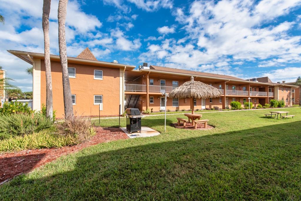 12760 Indian Rocks Road, Unit 601 Largo, FL 33774 - Photo 27 of 47 a view of a house with a backyard porch and sitting area