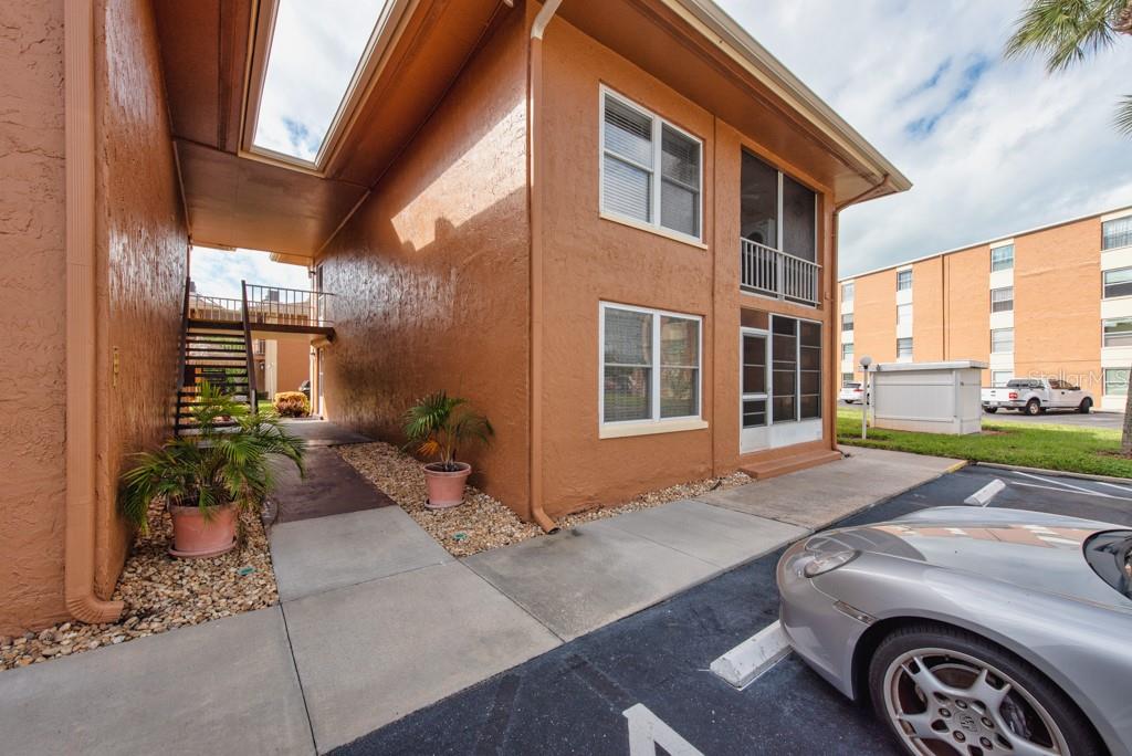 12760 Indian Rocks Road, Unit 601 Largo, FL 33774 - Photo 31 of 47 a front view of a house with a yard