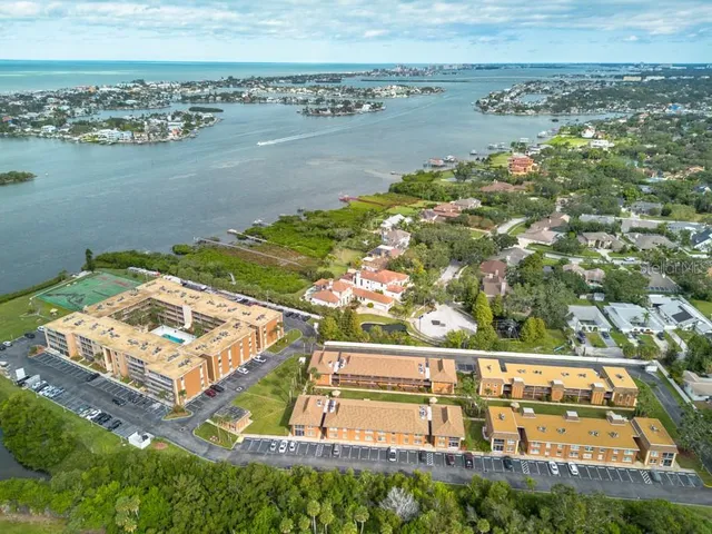 an aerial view of a house with a lake view