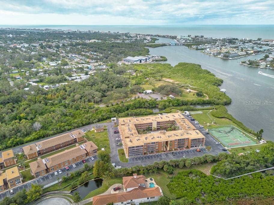 12760 Indian Rocks Road, Unit 601 Largo, FL 33774 - Photo 44 of 47 an aerial view of residential houses with outdoor space and river