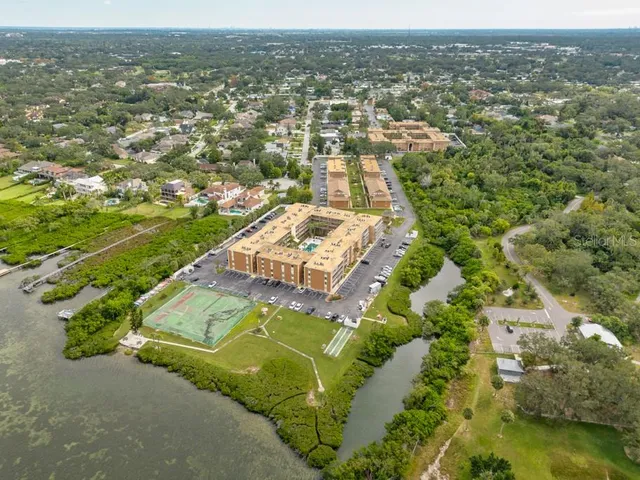 an aerial view of a house with a lake view