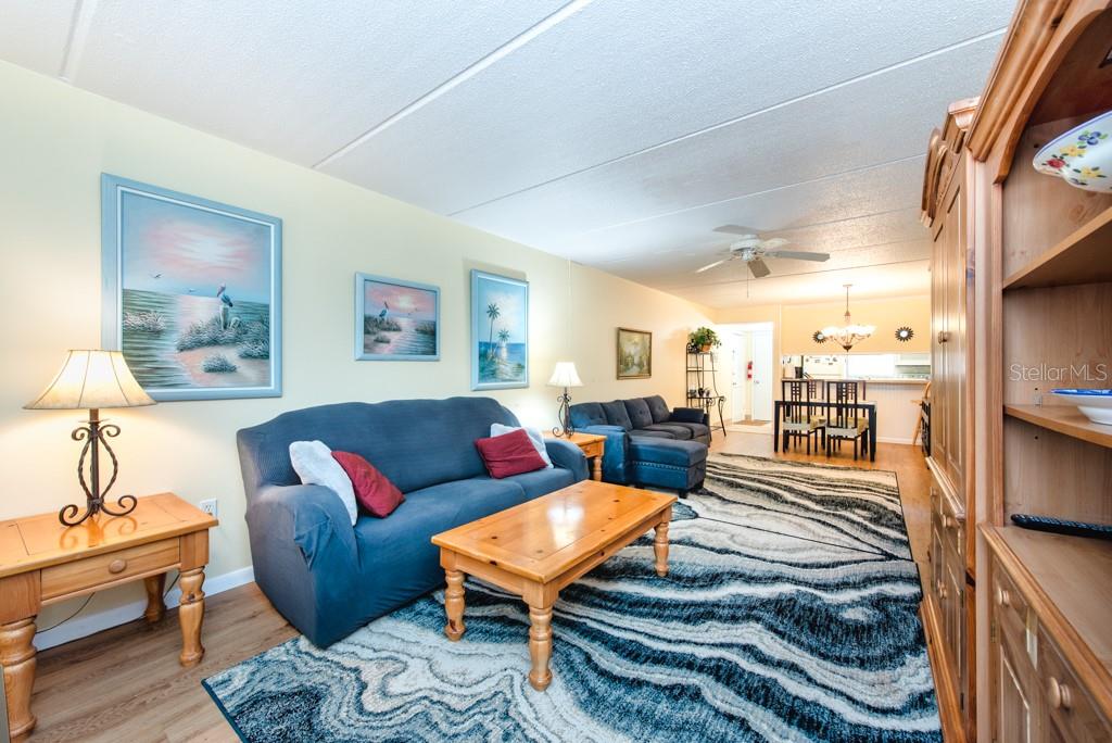 12760 Indian Rocks Road, Unit 601 Largo, FL 33774 - Photo 9 of 47 a living room with furniture and a table