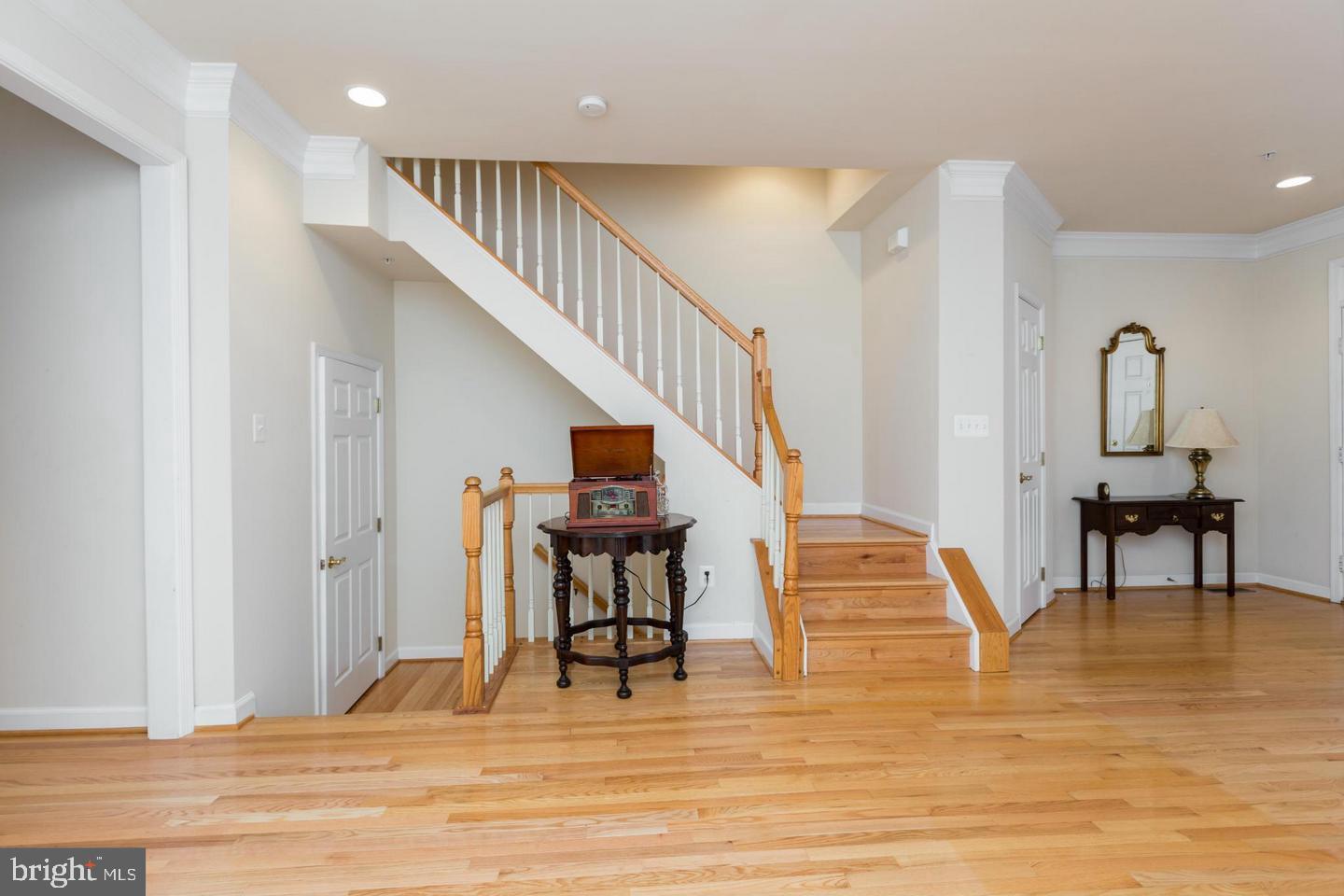 8857 Ashgrove House Lane Vienna, VA 22182 - Photo 11 of 34 Staircase going upstairs and downstairs.
