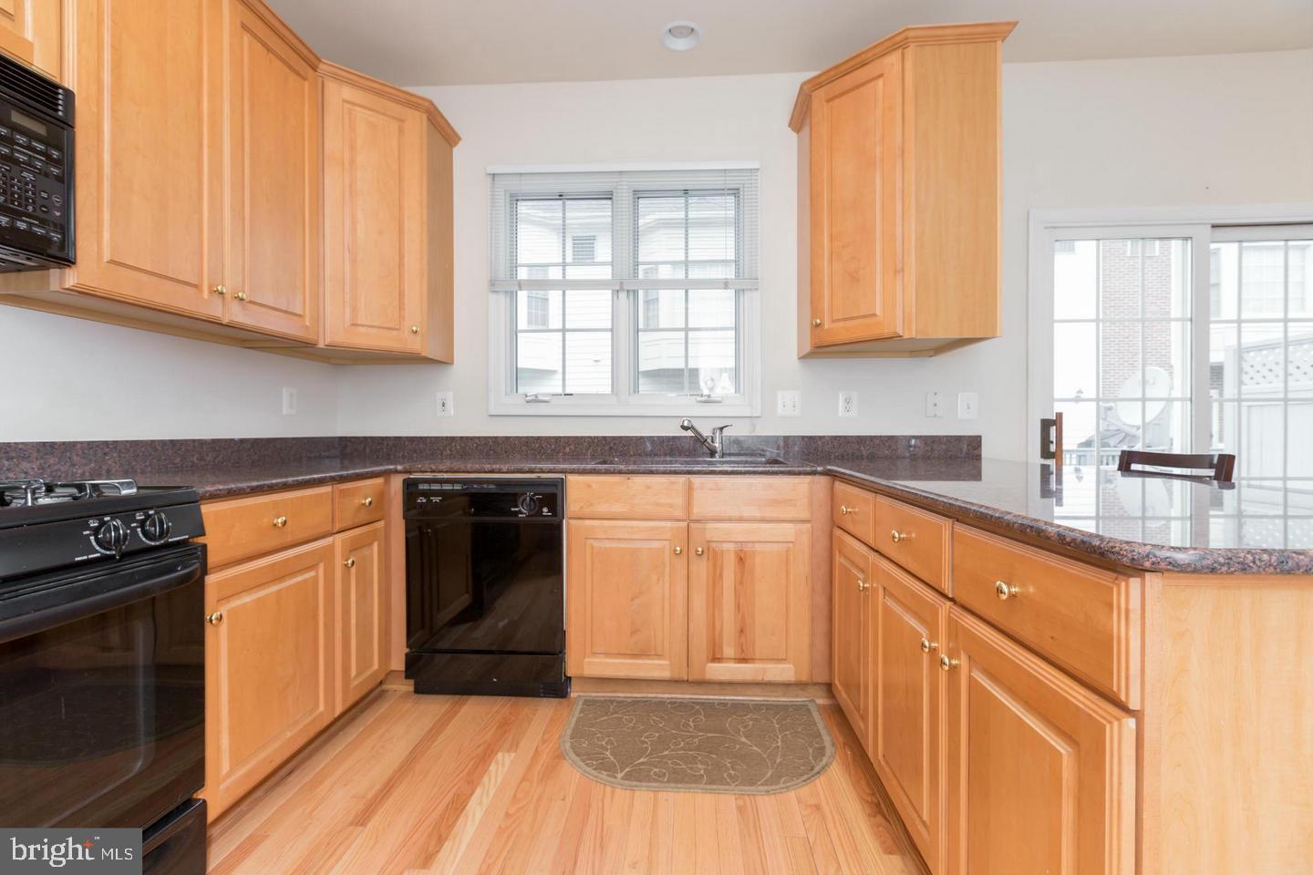 8857 Ashgrove House Lane Vienna, VA 22182 - Photo 2 of 34 Full kitchen with access to the patio.