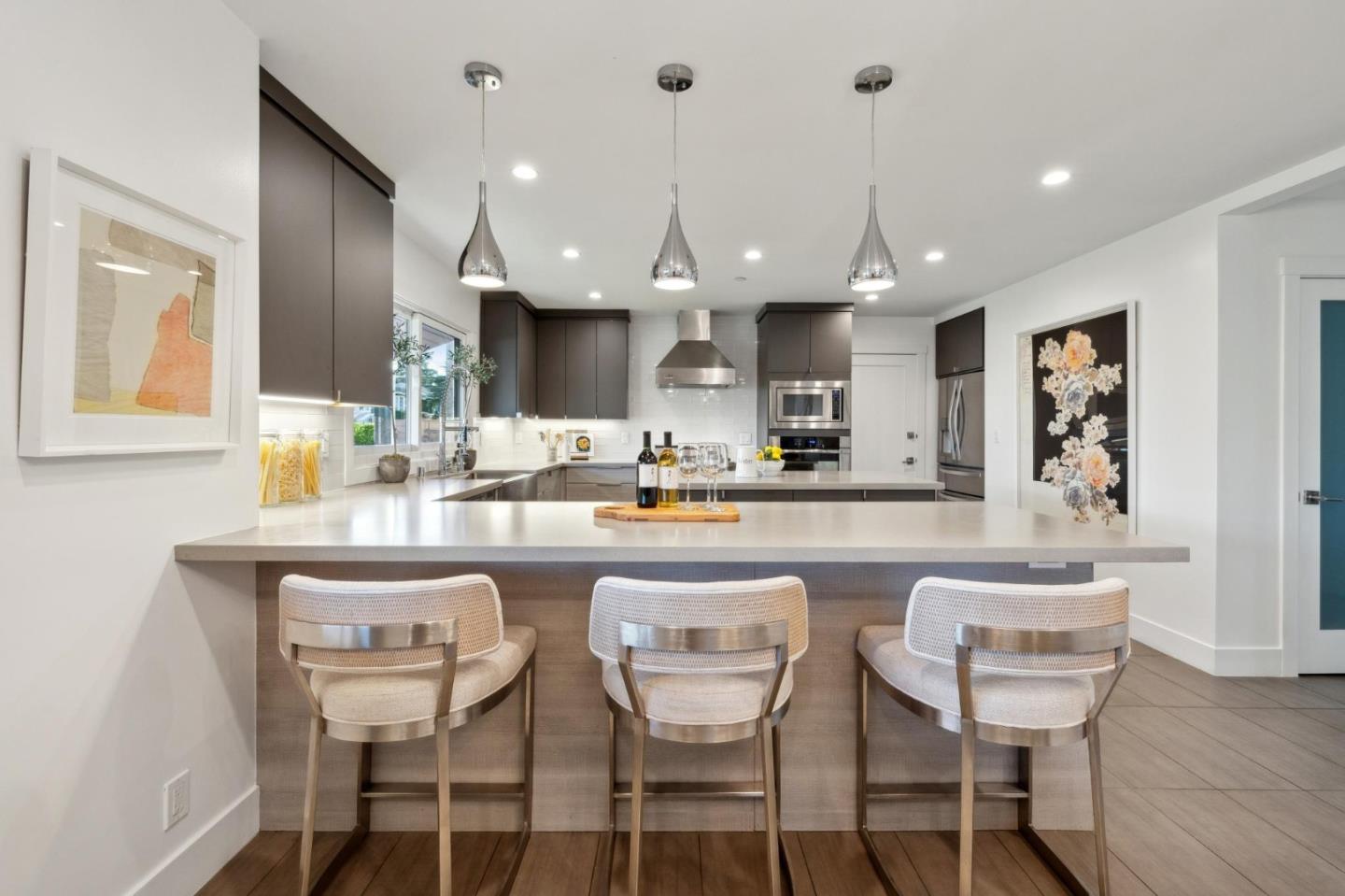 602 26th Avenue San Mateo, CA 94403 - Photo 11 of 41 a kitchen with a dining table chairs and sink