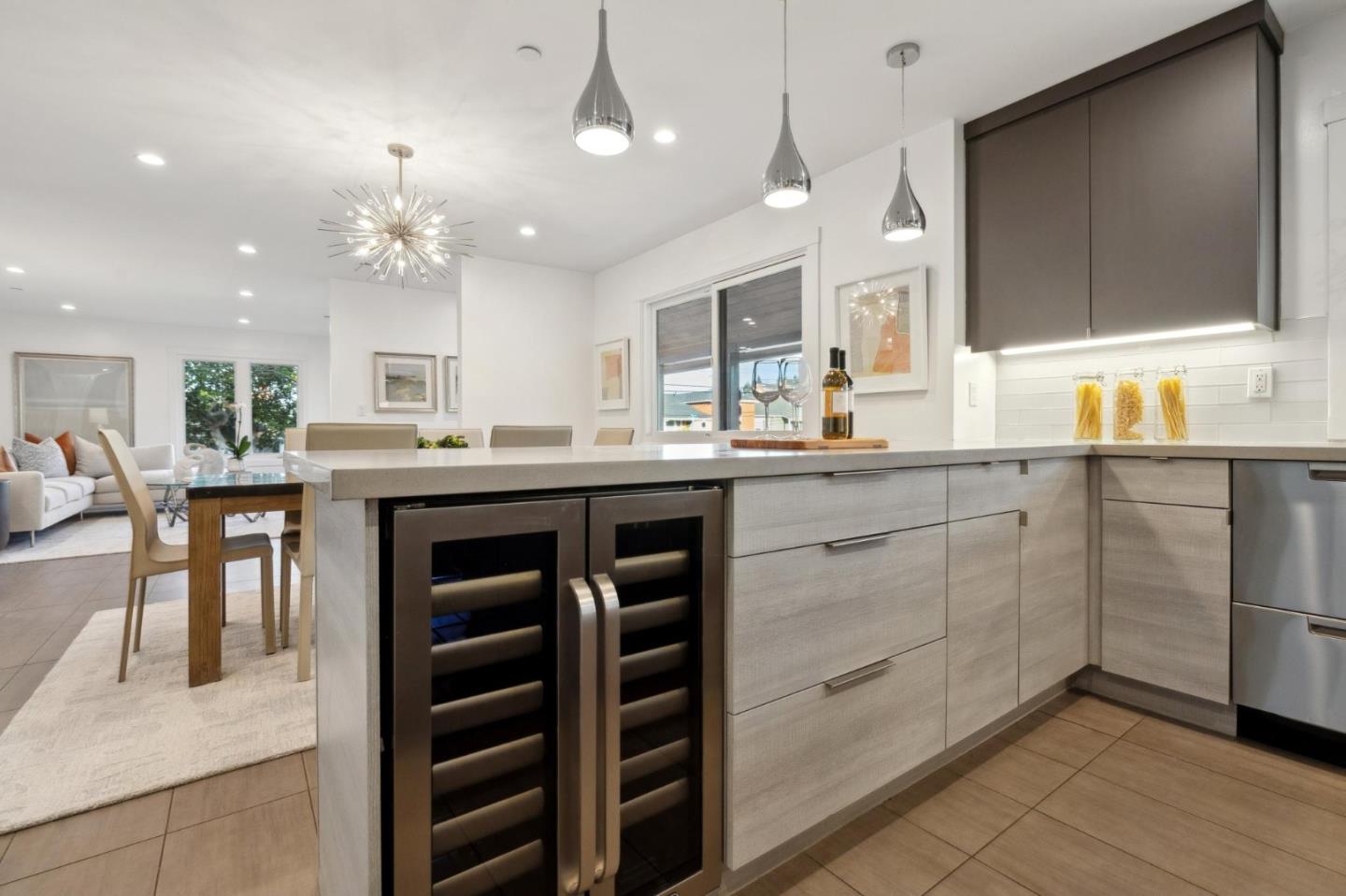 602 26th Avenue San Mateo, CA 94403 - Photo 13 of 41 a kitchen with kitchen island granite countertop a sink cabinets and stainless steel appliances