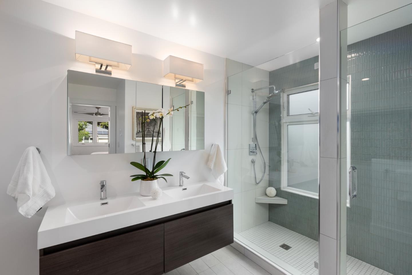 602 26th Avenue San Mateo, CA 94403 - Photo 18 of 41 a bathroom with a double vanity sink mirror and shower