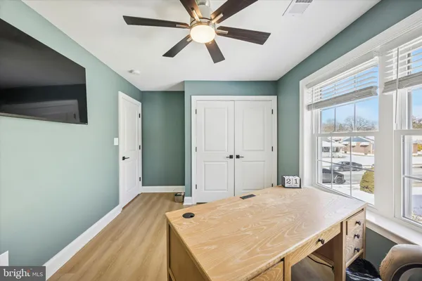 a bed room with a bed window and table