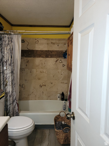 10429 4th Street East Randlett, UT 84063 - Photo 9 of 19 Bathtub and shower combination featuring a tiled surround with a decorative accent band