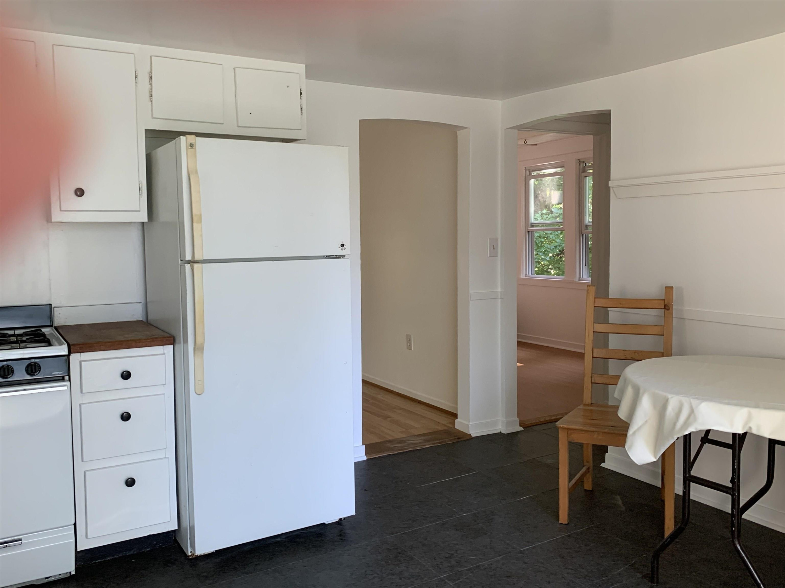 180 Bruceville Road High Falls, NY 12440 - Photo 13 of 22 a white refrigerator freezer and a stove sitting inside of a kitchen