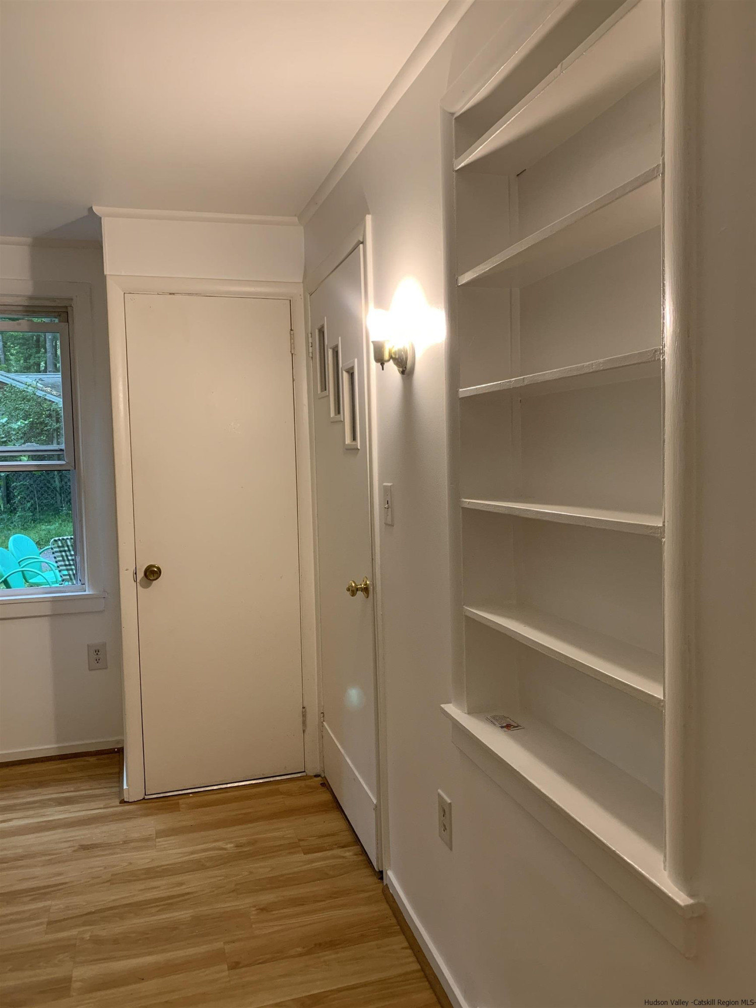 180 Bruceville Road High Falls, NY 12440 - Photo 6 of 22 a view of an empty room with wooden floor and a window