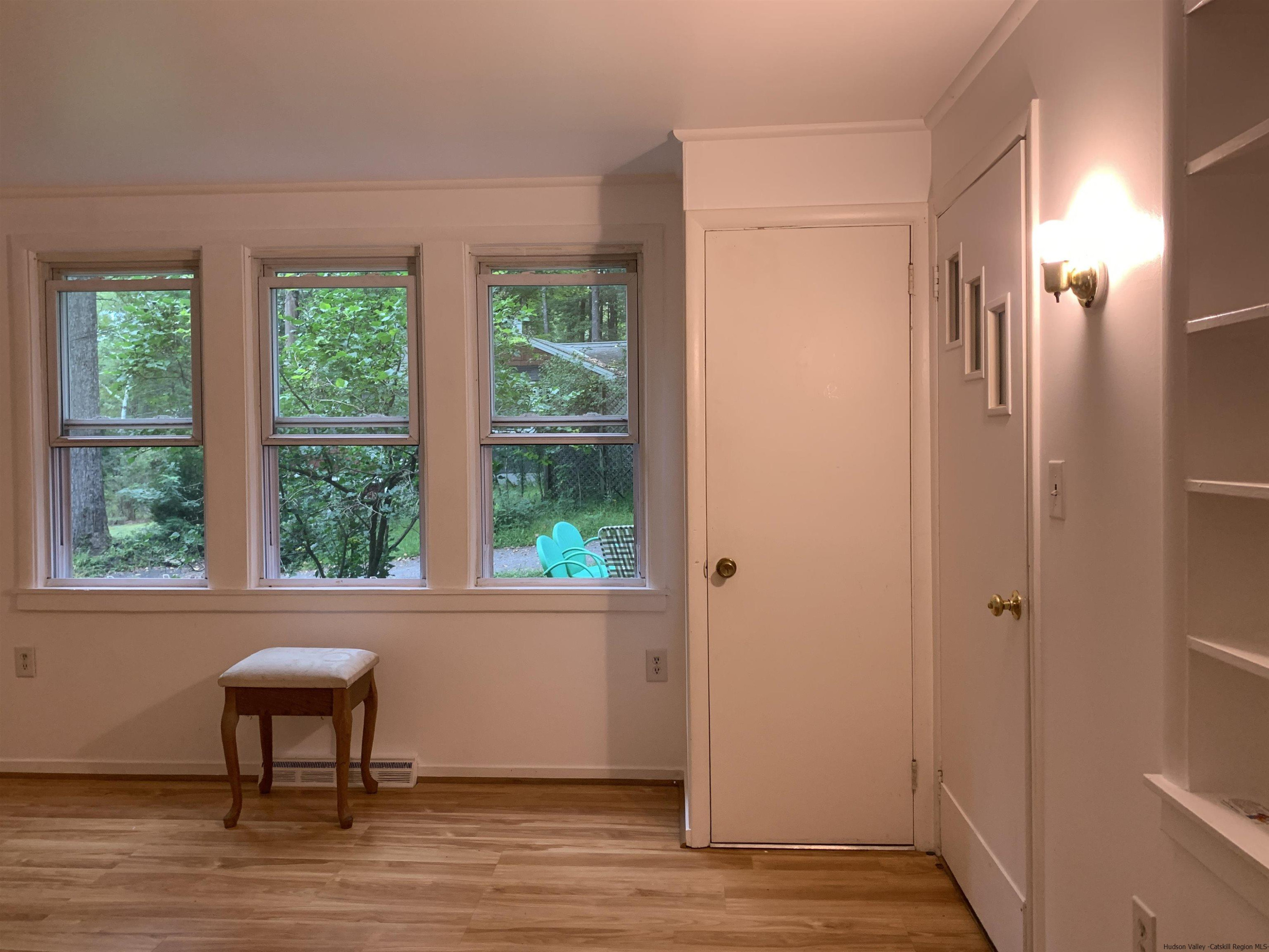 180 Bruceville Road High Falls, NY 12440 - Photo 7 of 22 a view of a livingroom with a window and wooden floor