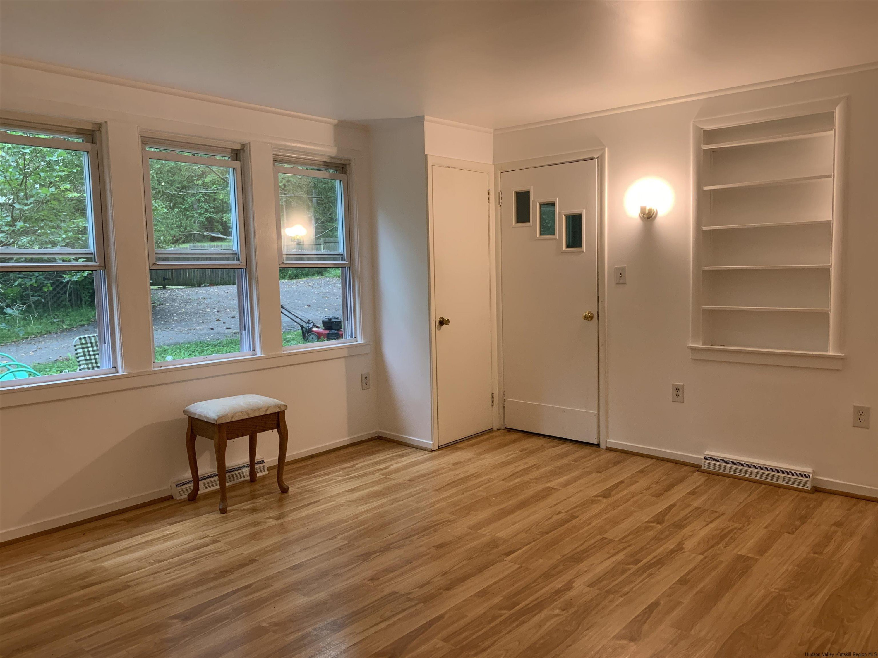 180 Bruceville Road High Falls, NY 12440 - Photo 8 of 22 an empty room with wooden floor and windows