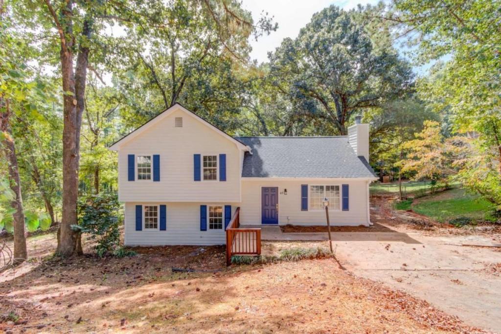 65 Melton Way Covington, GA 30016 - Photo 1 of 1 front view of a house with a yard