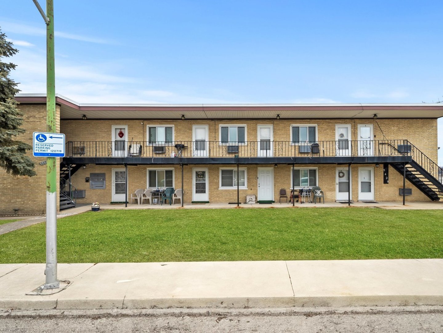 5429 South Massasoit Avenue, Unit 1 Chicago, IL 60638 - Photo 1 of 1 a view of a big house with a big yard and large trees