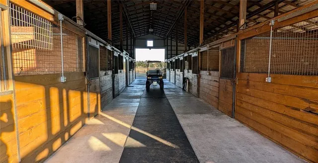 an aerial view of a house with a swimming pool