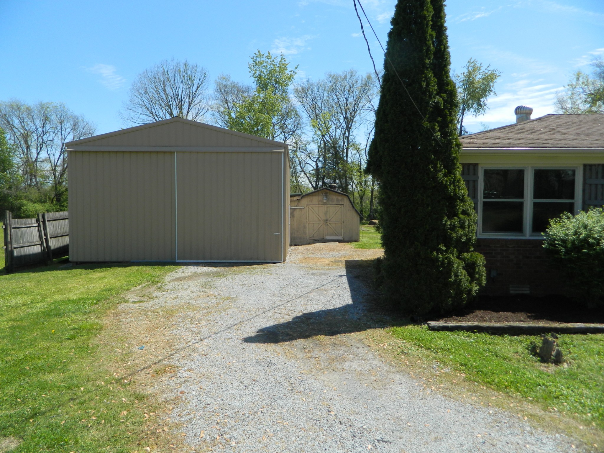 2178 North Ranch Road Murfreesboro, TN 37129 - Photo 3 of 8 a front view of a house with a yard and garage