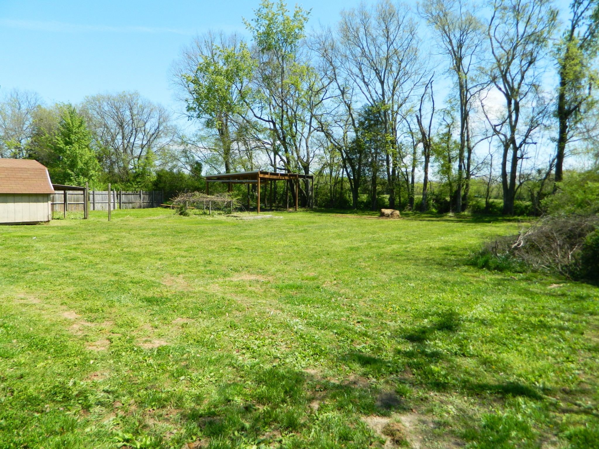 2178 North Ranch Road Murfreesboro, TN 37129 - Photo 8 of 8 a view of a grassy field with trees